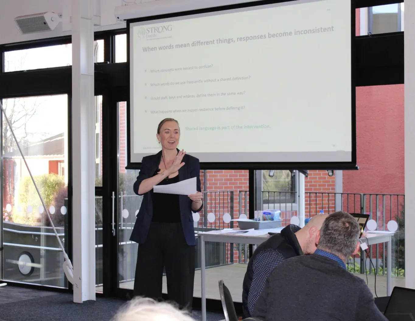Emily Baird presenting to school staff during a professional development session.